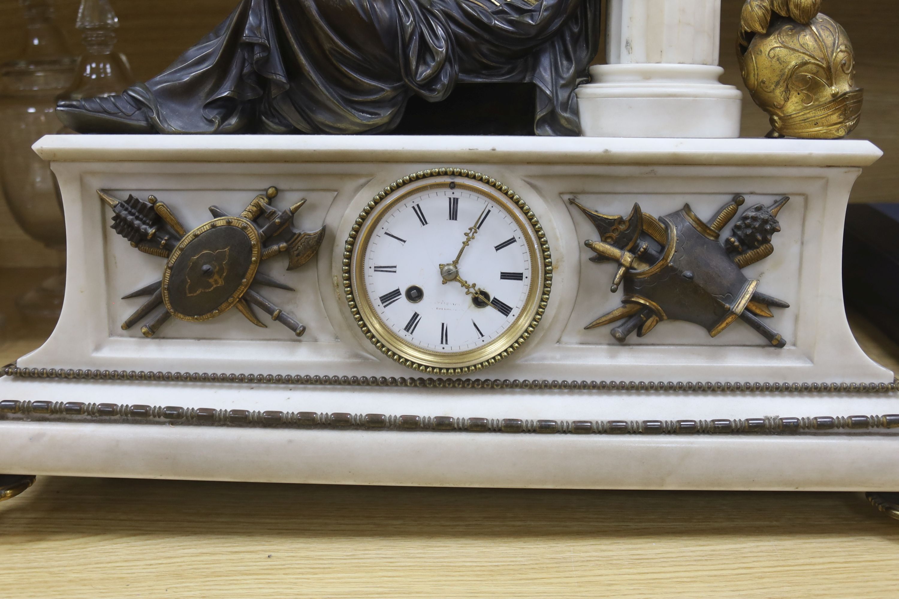 A 19th century gilt metal and marble figural mantel clock, length 58cm